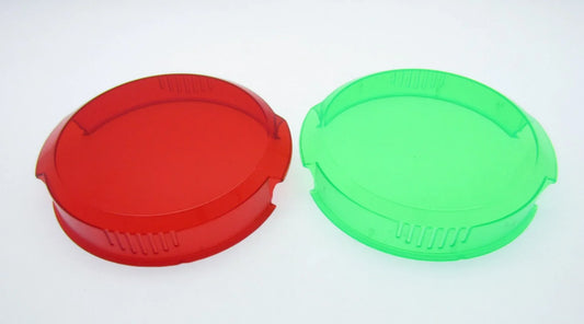 Red and green plastic lens filters for LED torches or spotlights, compatible with camping and fishing gear